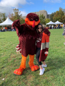 Natalie attending her first Virginia Tech vs. Syracuse football game, with the VT Mascot, the Hokie Bird.
