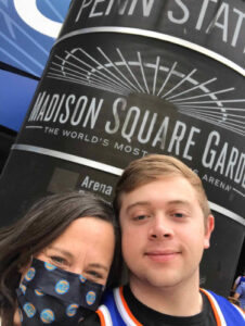 Natalie and her son attending a basketball game at Madison Square Garden.
